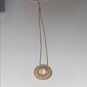Gold necklace with a (D)